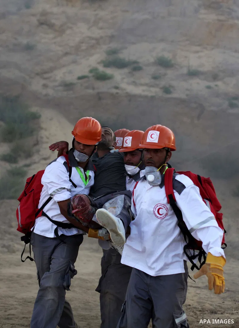 During a drill, Palestinian medics attend to a 'victim' of an explosion as part of an exercise of a graduation ceremony of medics, in Mughraqa, central Gaza Strip, Thursday, Sept. 5, 2013. Medics from the Palestine Red C...