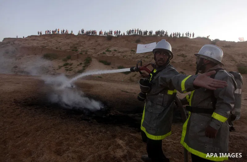During a drill, Palestinian medics attend to a 'victim' of an explosion as part of an exercise of a graduation ceremony of medics, in Mughraqa, central Gaza Strip, Thursday, Sept. 5, 2013. Medics from the Palestine Red C...