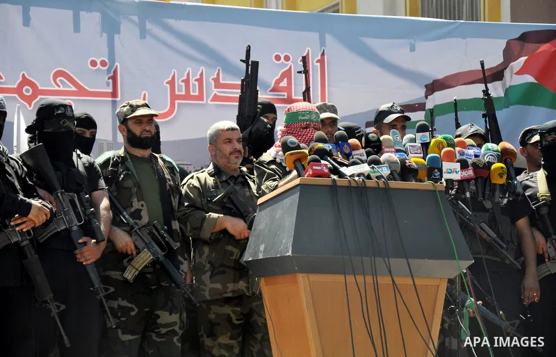 Palestinian militants hold a press conference following a protest against peace talks between Israel and the Palestinians, as well as possible U.S. attacks on Syria, in the northern Gaza Strip September 6, 2013. The prot...