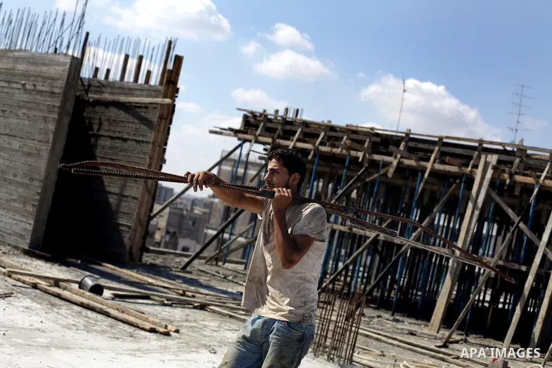 Palestinian construction workers work at the site in Gaza city on Sep. 09, 2013. The Palestinian government in Gaza Strip expected during a press conference on monday that 276 thousand workers lose their jobs following t...
