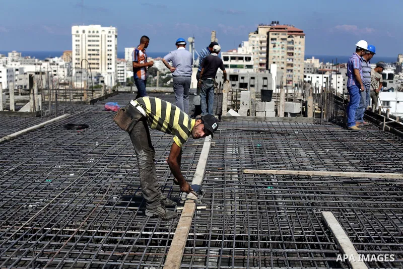Palestinian construction workers work at the site in Gaza city on Sep. 09, 2013. The Palestinian government in Gaza Strip expected during a press conference on monday that 276 thousand workers lose their jobs following t...