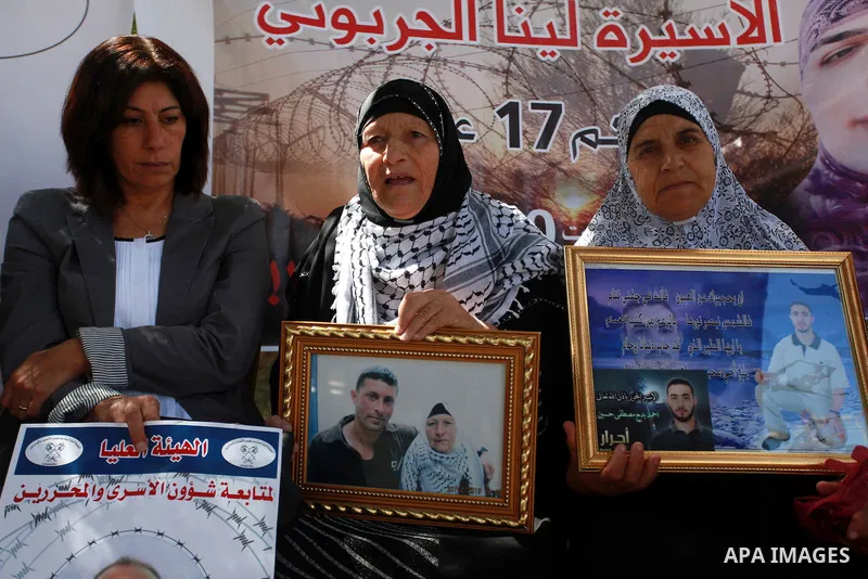 Families of Palestinian prisoners in the weekly sit-in to calling for the release of Palestinian prisoners from Israeli jails in front of the Red Cross in the West Bank city of Ramallah, on Sep. 10, 2013. Photo by Issam...