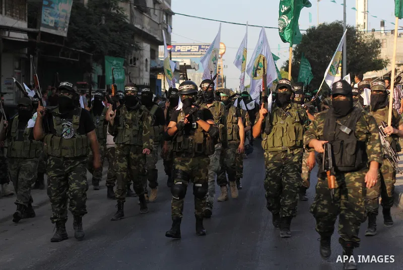 Palestinian Hamas militants take part in a protest against peace talks between Israel and the Palestinians, in Gaza City September 14, 2013. . Photo by Ezz Zanoun