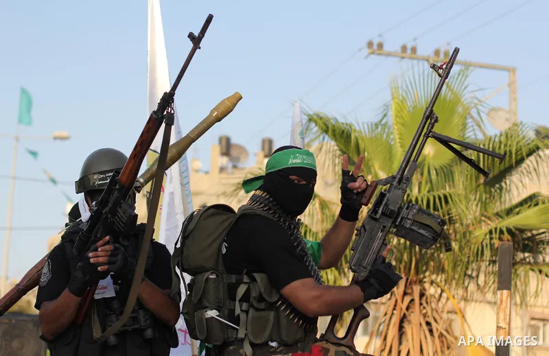 Palestinian Hamas militants take part in a protest against peace talks between Israel and the Palestinians, in Gaza City September 14, 2013. . Photo by Ezz Zanoun