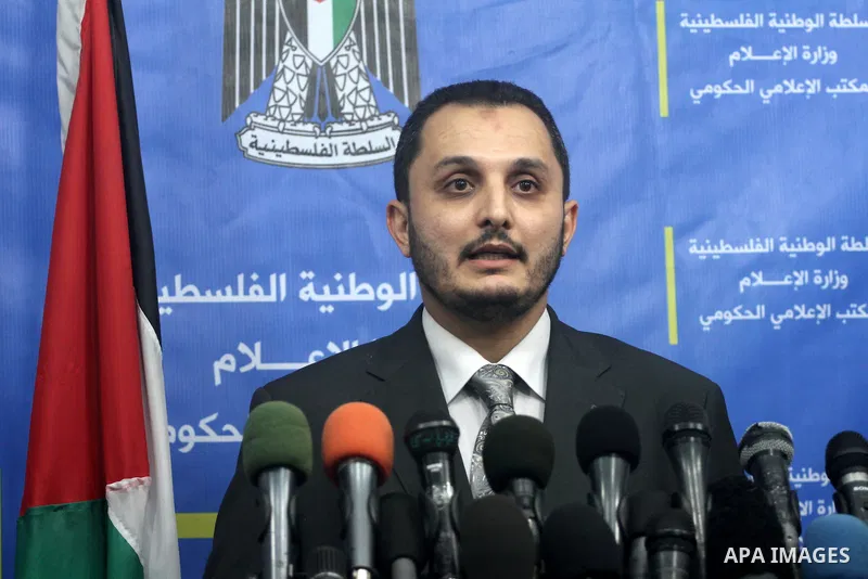 Spokesman of Palestinian government in Gaza Strip Ihab al-Ghussein speaks during a press conference, in Gaza City, Sept. 15, 2013. al-Ghussein dismissed the claims of authorities in Cairo and Egyptian media of interferin...