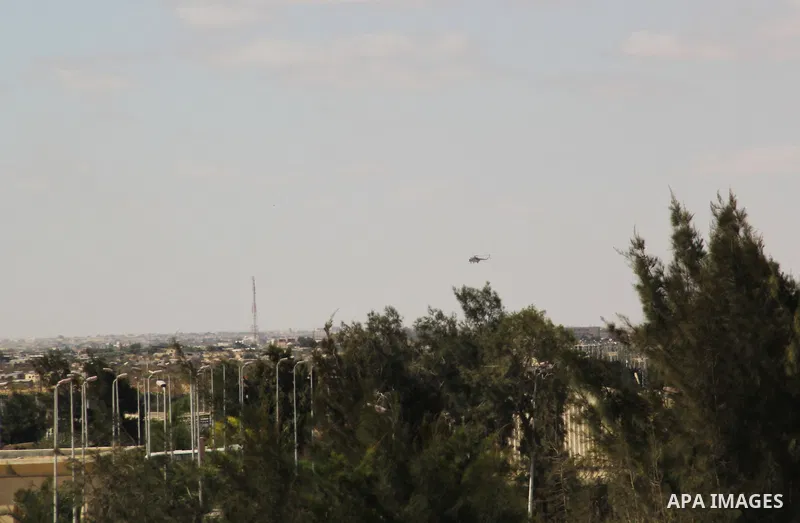 An Egyptian army helicopter patrols over the border between Gaza Strip and Egypt, Sept, 17, 213. Cairo closed the Rafah crossing, Gaza's main window to the world, completely last week after assailants crashed two explosi...