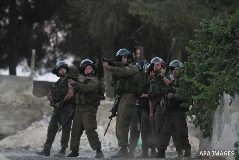 Israeli security forces fire tear gas at Palestinian protesters during clashes following a demonstration near Israel's Ofer military prison in the West Bank city of Ramallah Sept. 20, 2013. Palestinians took part in the...