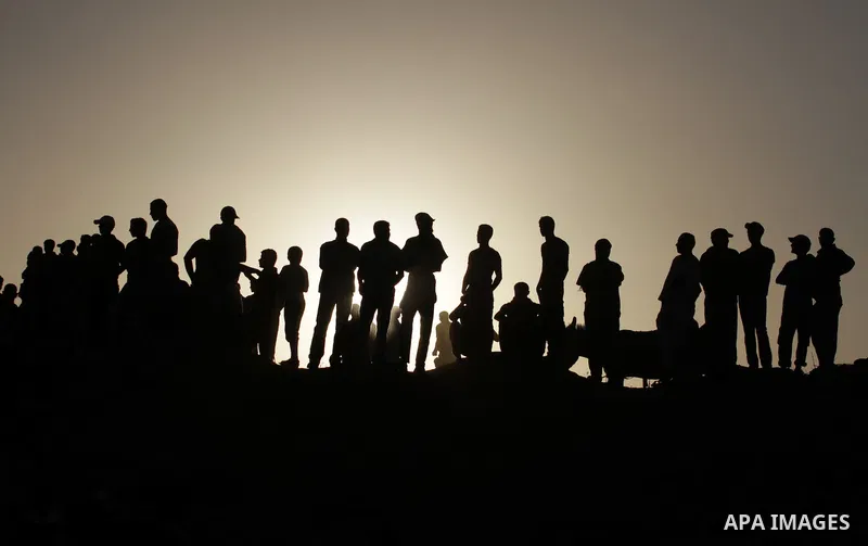Palestinian spectators attend a horse race and show in the North of the Gaza Strip, 22 September 2013. Every other Sunday Palestinians gather to race and show off their horses. A race is held between seven horses and the...