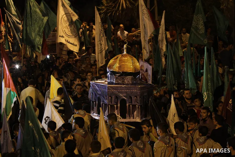 Palestinian Hamas supporters hold movement flags during a rally marking 13th anniversary of the so-called Al-Aqsa uprising or 'Second Intifada', in Gaza City, 26 September 2013. Palestinians marked the 13th anniversary o...