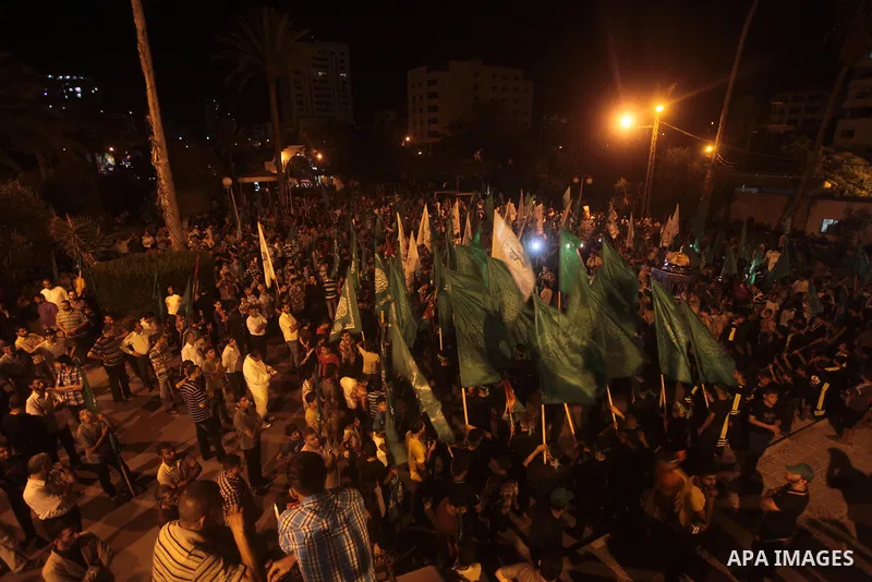 Palestinian Hamas supporters hold movement flags during a rally marking 13th anniversary of the so-called Al-Aqsa uprising or 'Second Intifada', and against visits to a disputed Jerusalem holy site by religious Jews, cla...