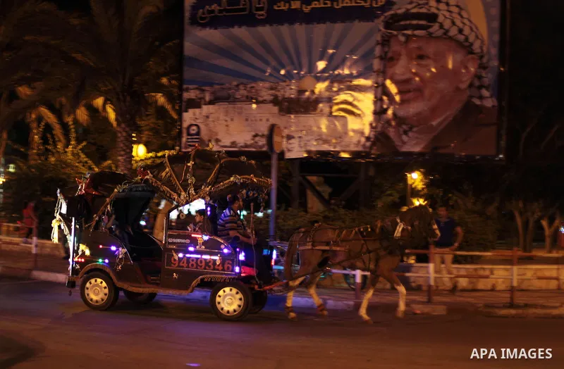 A Palestinian man rides in a carriage on September 26, 2013 in Gaza City. Photo by Ashraf Amra