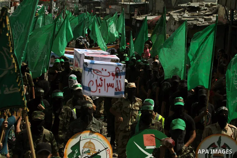 Palestinian hamas supporters take part in a protest to show solidarity with Al-Aqsa mosque after Friday prayers in the central Gaza Strip September 27, 2013. Photo by Ashraf Amra