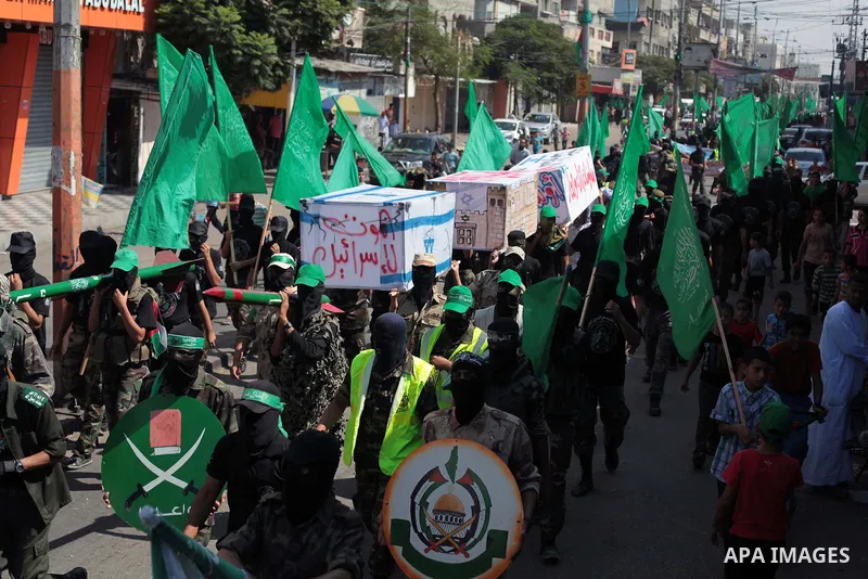 Palestinian hamas supporters take part in a protest to show solidarity with Al-Aqsa mosque after Friday prayers in the central Gaza Strip September 27, 2013. Photo by Ashraf Amra