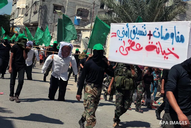 Palestinian hamas supporters take part in a protest to show solidarity with Al-Aqsa mosque after Friday prayers in the central Gaza Strip September 27, 2013. Photo by Ashraf Amra