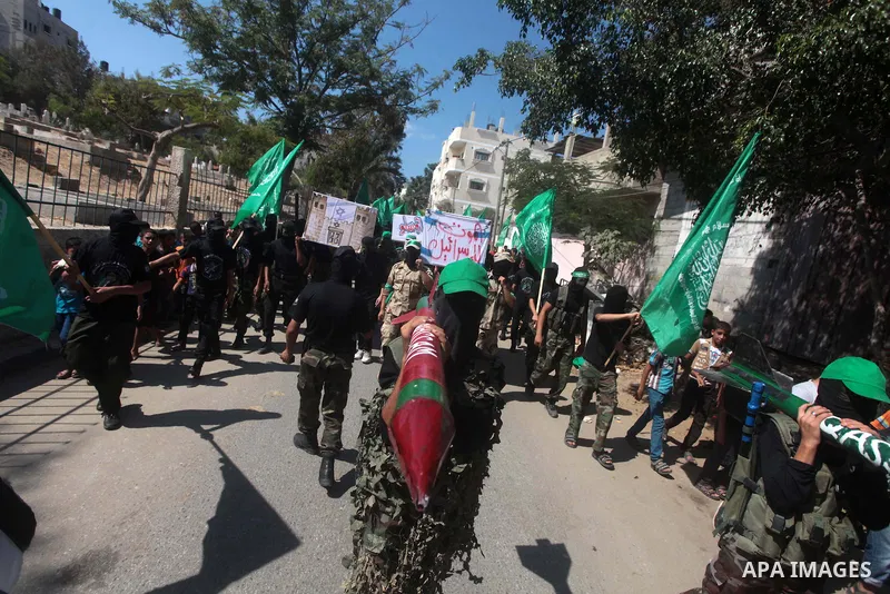 Palestinian hamas supporters take part in a protest to show solidarity with Al-Aqsa mosque after Friday prayers in the central Gaza Strip September 27, 2013. Photo by Ashraf Amra