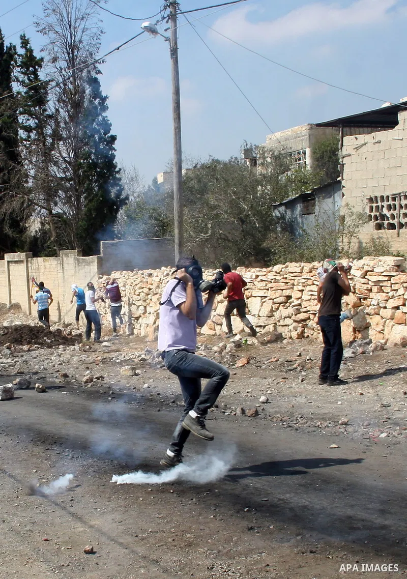 Palestinian protesters clash with Israeli security forces following a demonstration against the expropriation of Palestinian land by Israel and in support of Jerusalem's Al-Aqsa mosque, on September 27, 2013, in the vill...