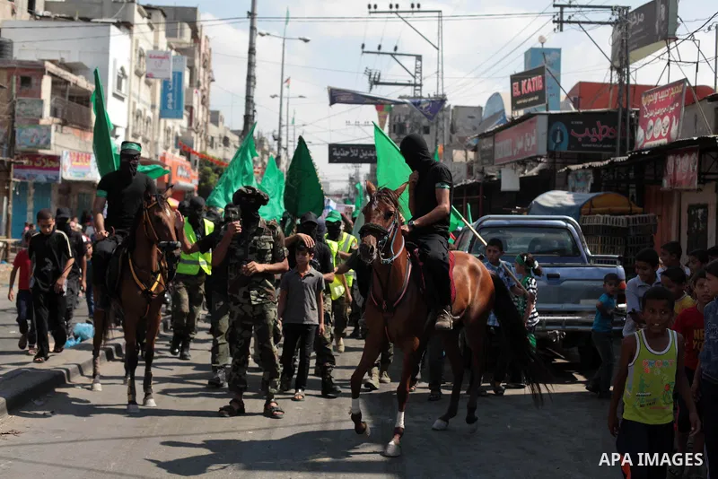 Palestinian Hamas supporters take part in a protest to show solidarity with Al-Aqsa mosque after Friday prayers in the central Gaza Strip September 27, 2013. Israeli police clashed with Palestinian protesters in Jerusale...