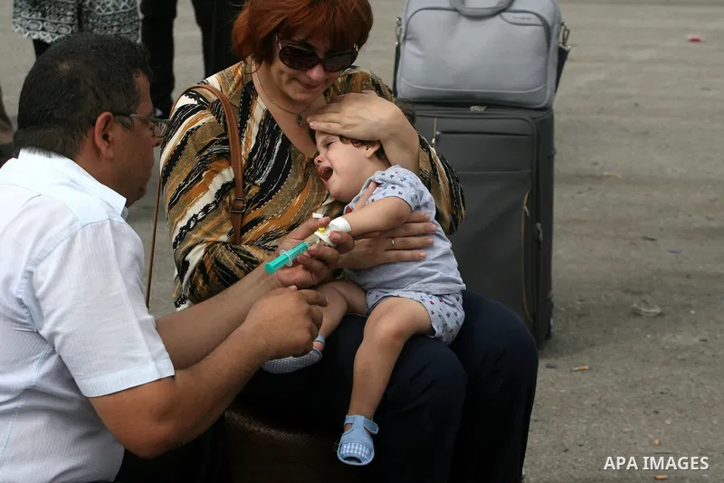 Palestinians wait at the Rafah border crossing in the southern Gaza Strip on September 28, 2013, for a brief opening allowing special cases to cross after Egyptian authorities closed the crossing "indefinitely" the day b...