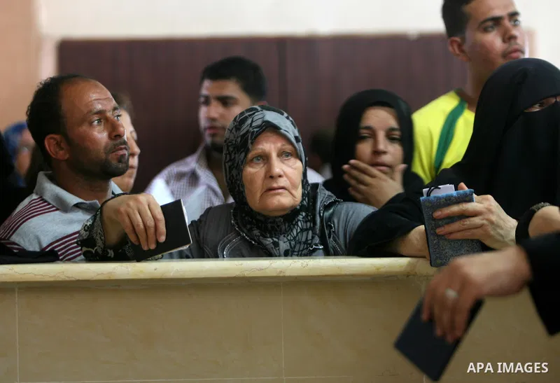 Palestinians wait at the Rafah border crossing in the southern Gaza Strip on September 28, 2013, for a brief opening allowing special cases to cross after Egyptian authorities closed the crossing "indefinitely" the day b...