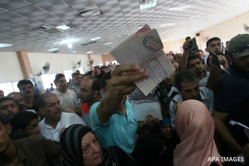 Palestinians wait at the Rafah border crossing in the southern Gaza Strip on September 28, 2013, for a brief opening allowing special cases to cross after Egyptian authorities closed the crossing "indefinitely" the day b...