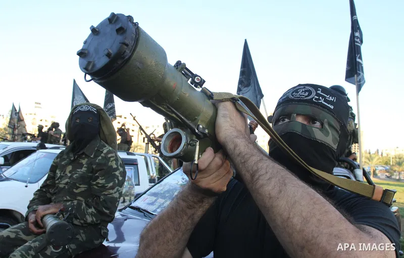 Palestinian militants from Al Nasser Brigades, an armed wing of the Popular Resistance Committees (PRC), take part in a training session in Gaza City, Sept. 28, 2013. Photo by Mohammed Asad