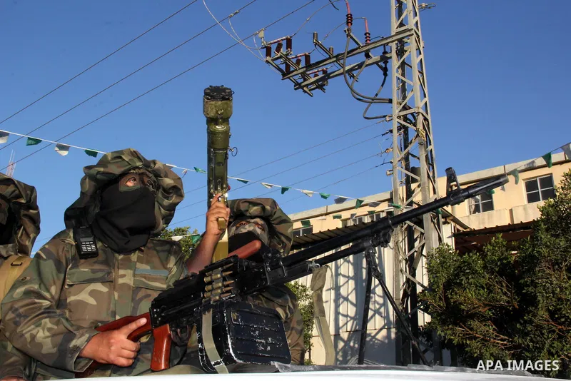 Palestinian militants from Al Nasser Brigades, an armed wing of the Popular Resistance Committees (PRC), take part in a training session in Gaza City, Sept. 28, 2013. Photo by Mosad al-Mahmuom