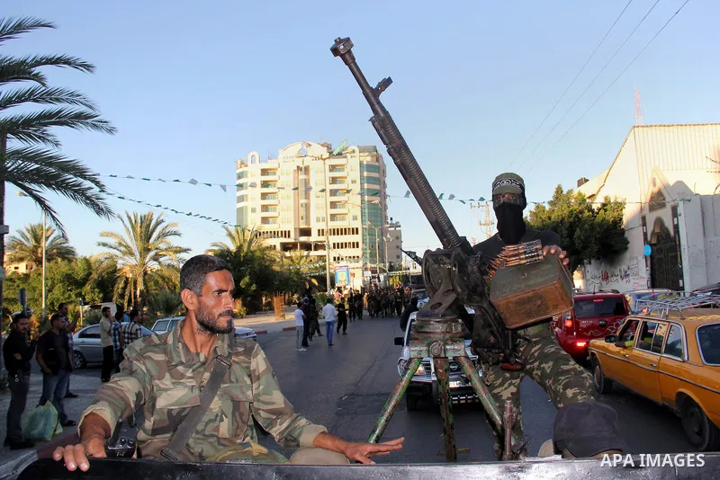 Palestinian militants from Al Nasser Brigades, an armed wing of the Popular Resistance Committees (PRC), take part in a training session in Gaza City, Sept. 28, 2013. Photo by Mosad al-Mahmuom