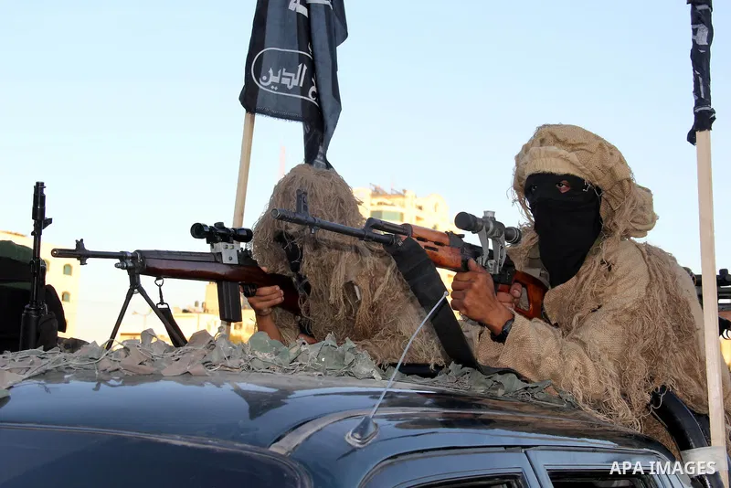 Palestinian militants from Al Nasser Brigades, an armed wing of the Popular Resistance Committees (PRC), take part in a training session in Gaza City, Sept. 28, 2013. Photo by Mosad al-Mahmuom