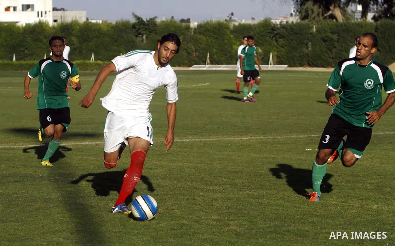 Palestinian soccer team Union Shijaia club compete against Islamic Society club during the Premier League in Gaza City on Sept. 28, 2013. Union Shijaia club beat off Islamic society club 2-0. Photo by Alaa Shamaly