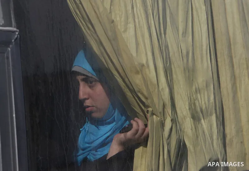 Palestinian passengers, hoping to cross into Egypt, searches for her bag as she waits at the Rafah crossing, between Egypt and the southern Gaza Strip, September 30, 2013. Egypt partially reopened its border crossing wit...