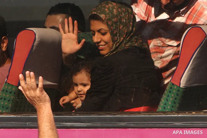 Palestinian passengers, hoping to cross into Egypt, searches for her bag as she waits at the Rafah crossing, between Egypt and the southern Gaza Strip, September 30, 2013. Egypt partially reopened its border crossing wit...