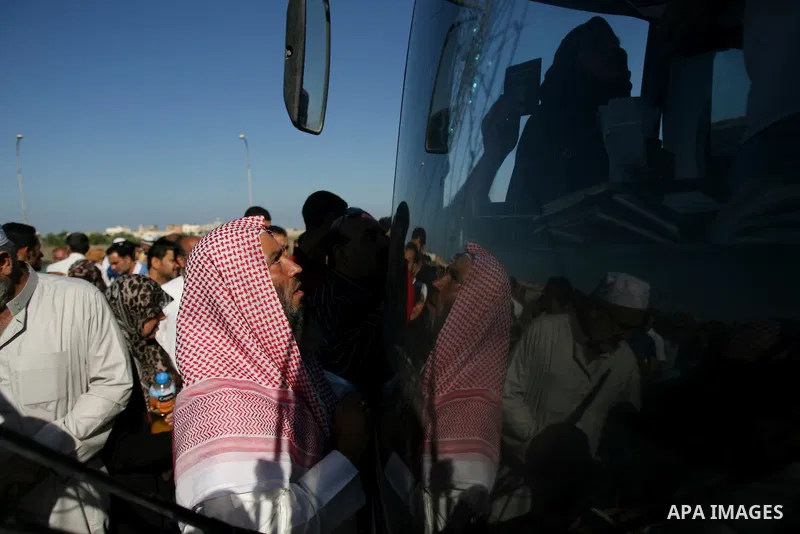 Palestinian passengers, hoping to cross into Egypt, searches for her bag as she waits at the Rafah crossing, between Egypt and the southern Gaza Strip, September 30, 2013. Egypt partially reopened its border crossing wit...