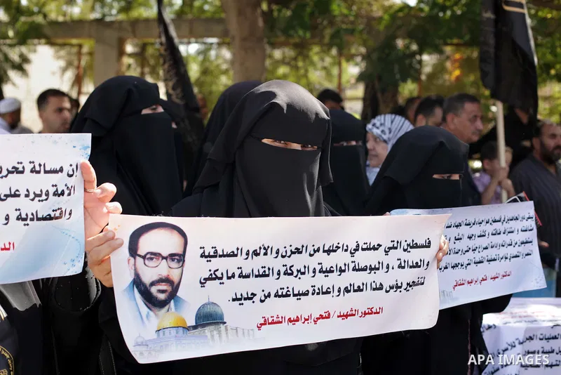 Palestinian supporters of the Islamic Jihad militant group participate in a protest in solidarity with palestinian prisoners held in Israeli jails, in front of the headquarters of the United Nations (UNRWA) in Gaza City,...