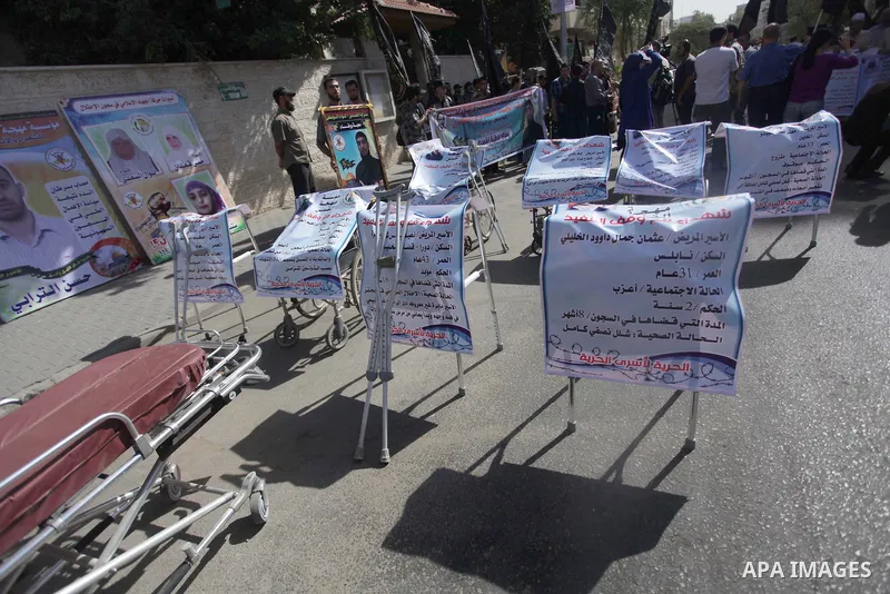 Palestinian supporters of the Islamic Jihad militant group participate in a protest in solidarity with palestinian prisoners held in Israeli jails, in front of the headquarters of the United Nations (UNRWA) in Gaza City,...