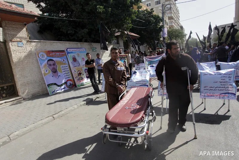 Palestinian supporters of the Islamic Jihad militant group participate in a protest in solidarity with palestinian prisoners held in Israeli jails, in front of the headquarters of the United Nations (UNRWA) in Gaza City,...