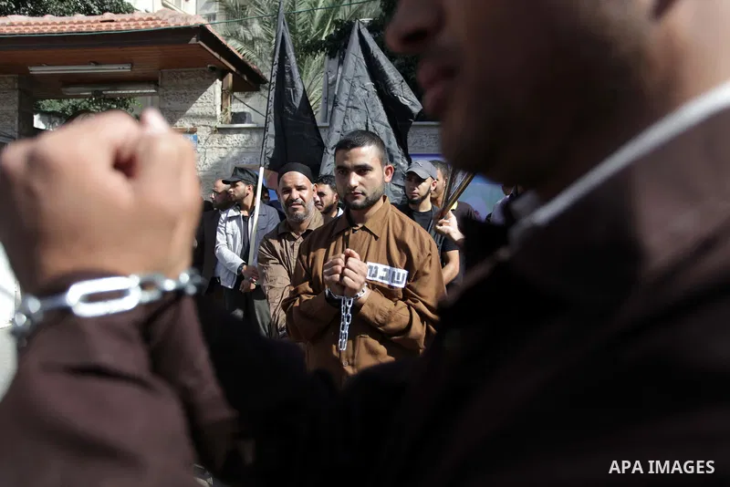 Palestinian supporters of the Islamic Jihad militant group participate in a protest in solidarity with palestinian prisoners held in Israeli jails, in front of the headquarters of the United Nations (UNRWA) in Gaza City,...