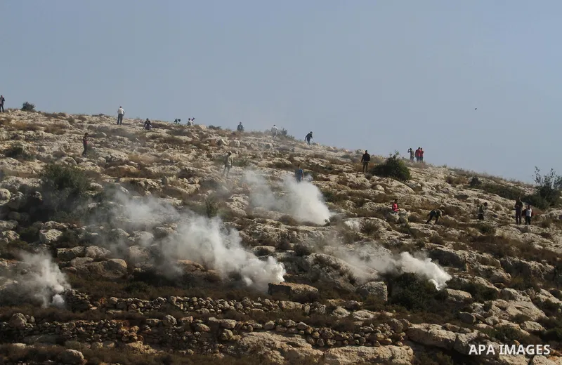 Palestinian youths clash with Israeli forces that led to killing of Palestinian Islamic Jihad militant Mohamed Assi in the village of Bilin near the West Bank city of Ramallah, Tuesday, Oct. 22, 2013. Israel's security s...