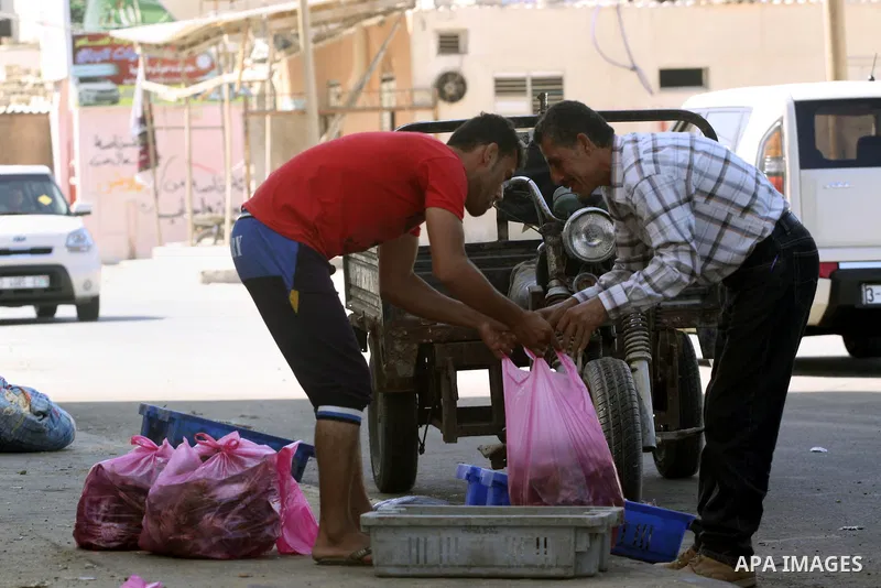 A Palestinian fishermen sells crabs at the beach of Gaza City, on Oct. 23, 2013. Israel restricted the fishing zone to three nautical miles following the kidnapping of Israeli soldier Gilad Shalit in 2007. The Oslo Accor...