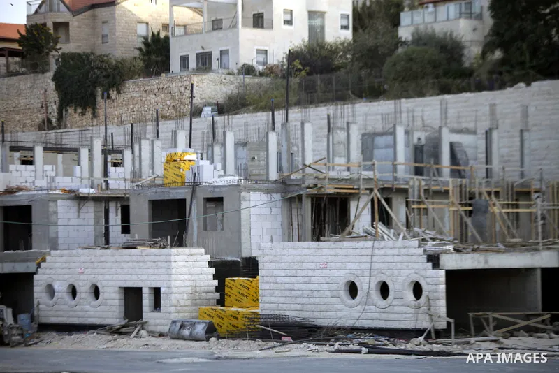 A construction site is seen in Pisgat Zeev, an urban settlement in an area Israel annexed to Jerusalem after the 1967 Middle East war, near the Arab village of Beit Hanina, North Jerusalem, October 29, 2013. The PLO deni...