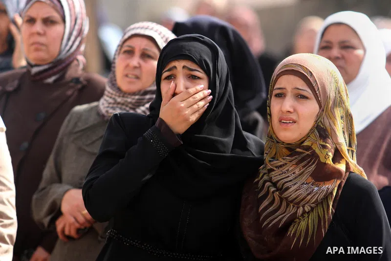 Relatives of Ahmed Imad Yusef mourn during his funeral in the West Bank village of Qabatiya, near Jenin October 31, 2013. Israeli troops shot dead Yusef, a Palestinian, during a clash in the occupied West Bank on Thursda...