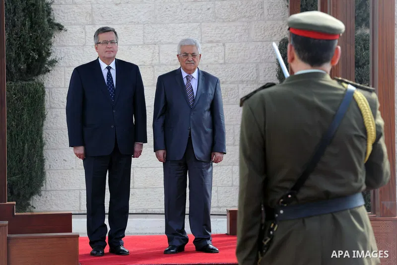 Palestinian President Mahmoud Abbas (R) and President of Poland, Bronislaw Komorowski review the honor guard during a welcoming ceremony ahead of a meeting in the West Bank city of Bethlehem on November 5, 2013. Photo by...