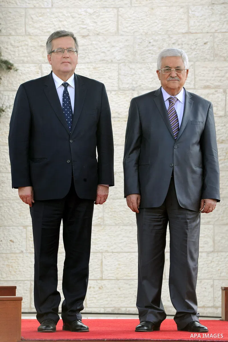 Palestinian President Mahmoud Abbas (R) and President of Poland, Bronislaw Komorowski pose for a photograph during a welcome ceremony ahead of a meeting in the West Bank city of Bethlehem on November 5, 2013. Photo by Th...