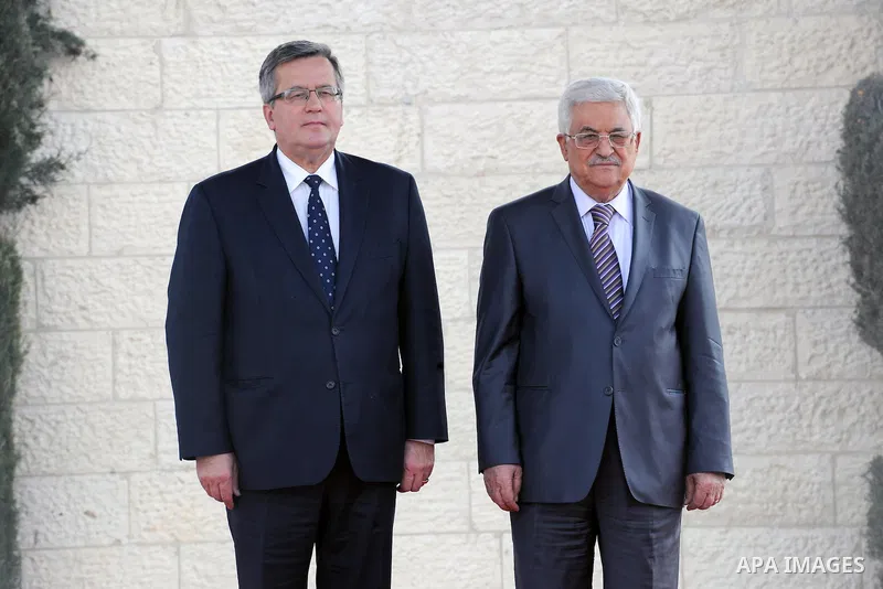Palestinian President Mahmoud Abbas (R) and President of Poland, Bronislaw Komorowski pose for a photograph during a welcome ceremony ahead of a meeting in the West Bank city of Bethlehem on November 5, 2013. Photo by Th...