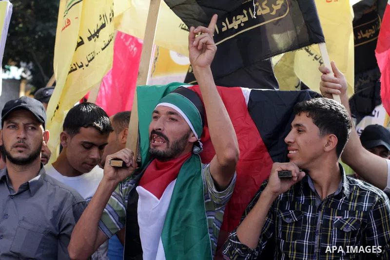 Palestinians take part in a military funeral for palestinian prisoner Hasan Turabi, in Gaza city 06 November 2013. who he died while serving a sentence in an Israeli prison. According to local news reports, Turabi, who w...
