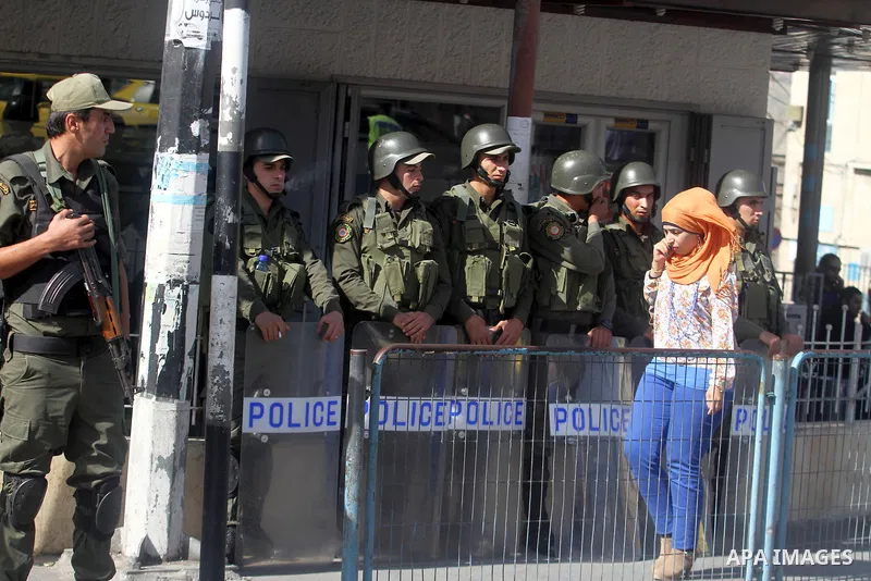 Palestinian security forces stand guard during a protest against the visit of the US Secretary of State John Kerry and peace negotiations, in the West Bank city of Bethlehem, 06 November 2013. Kerry began a day of meetin...