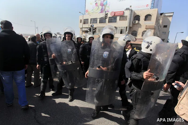 Palestinian security forces stand guard during a protest against the visit of the US Secretary of State John Kerry and peace negotiations, in the West Bank city of Bethlehem, 06 November 2013. Kerry began a day of meetin...