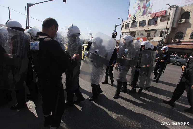 Palestinian security forces stand guard during a protest against the visit of the US Secretary of State John Kerry and peace negotiations, in the West Bank city of Bethlehem, 06 November 2013. Kerry began a day of meetin...