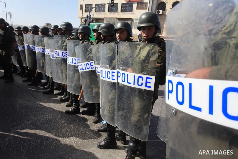 Palestinian security forces stand guard during a protest against the visit of the US Secretary of State John Kerry and peace negotiations, in the West Bank city of Bethlehem, 06 November 2013. Kerry began a day of meetin...