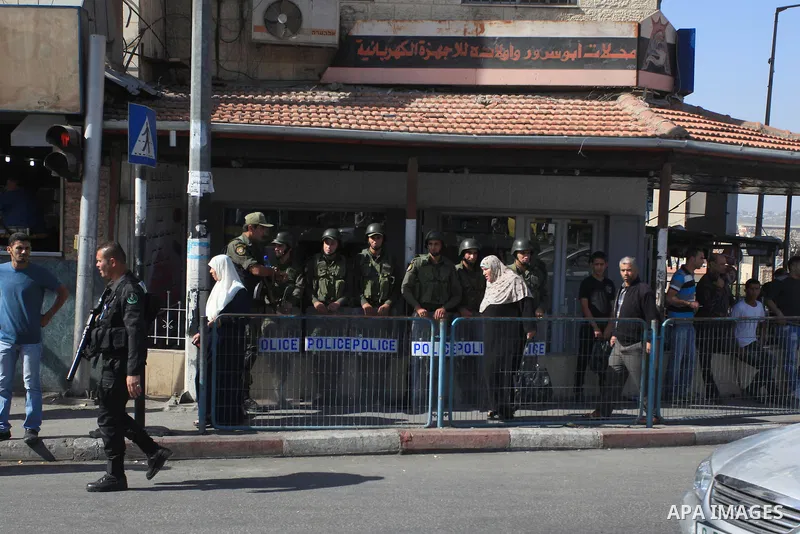 Palestinian security forces stand guard during a protest against the visit of the US Secretary of State John Kerry and peace negotiations, in the West Bank city of Bethlehem, 06 November 2013. Kerry began a day of meetin...