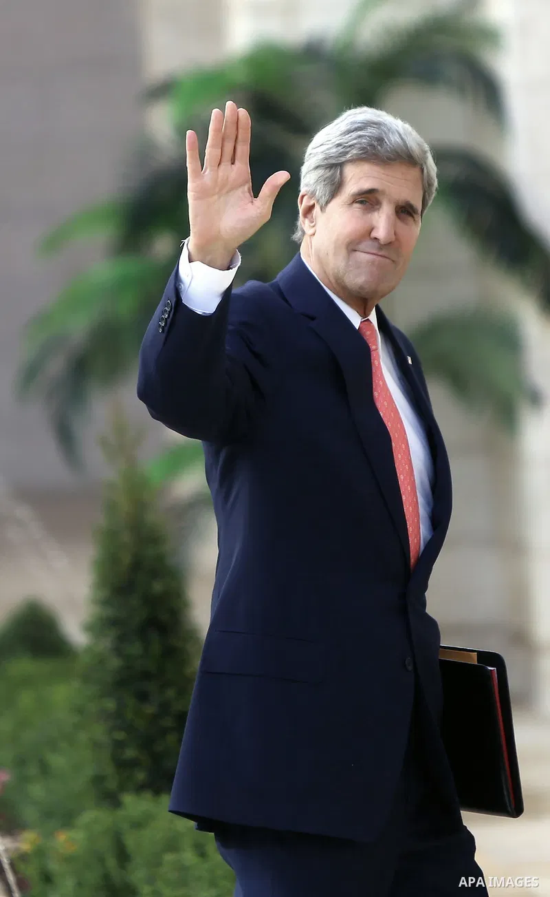 US Secretary of State John Kerry waves to media upon his arrival for a meeting with Palestinian President Mahmoud Abbas in the West Bank city of Bethlehem, 06 November 2013. Kerry began a day of meetings in Jerusalem and...